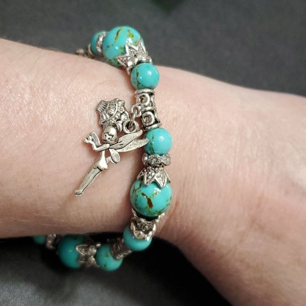 Silver tone fairy charm bracelet 7.25-10" blue bead